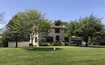 house with a green lawn