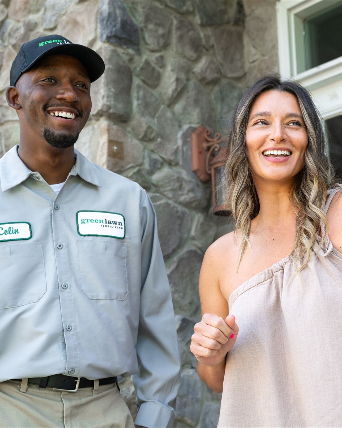 customer and technician talking about lawn care options