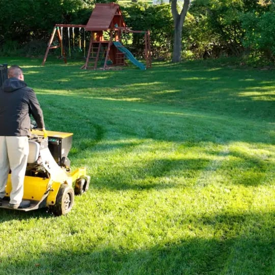 lawn technician riding aerator