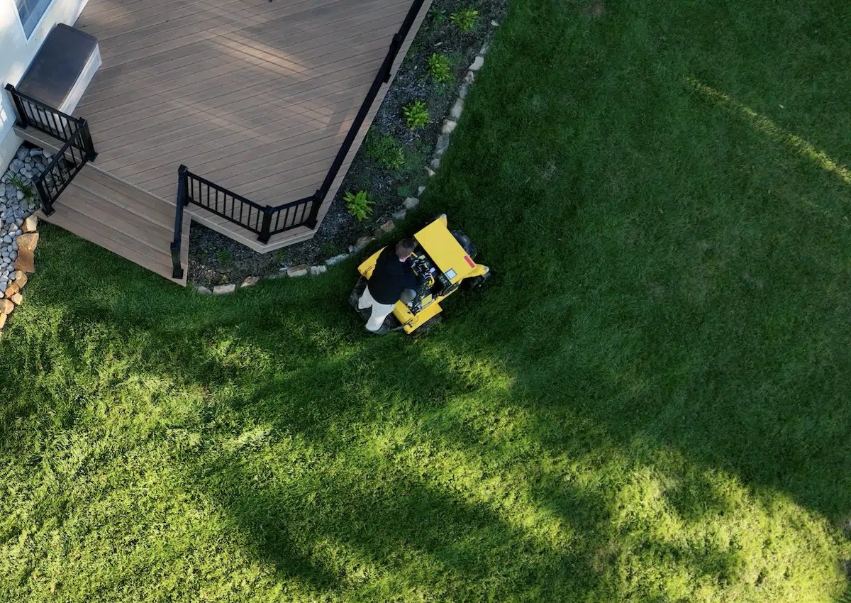 lawn aeration being done on a very green lawn