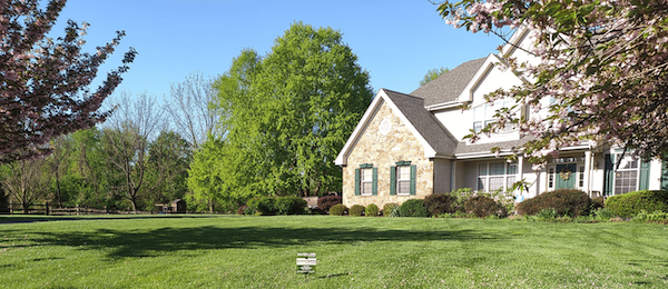 White House with Stone and a fertilized lawn