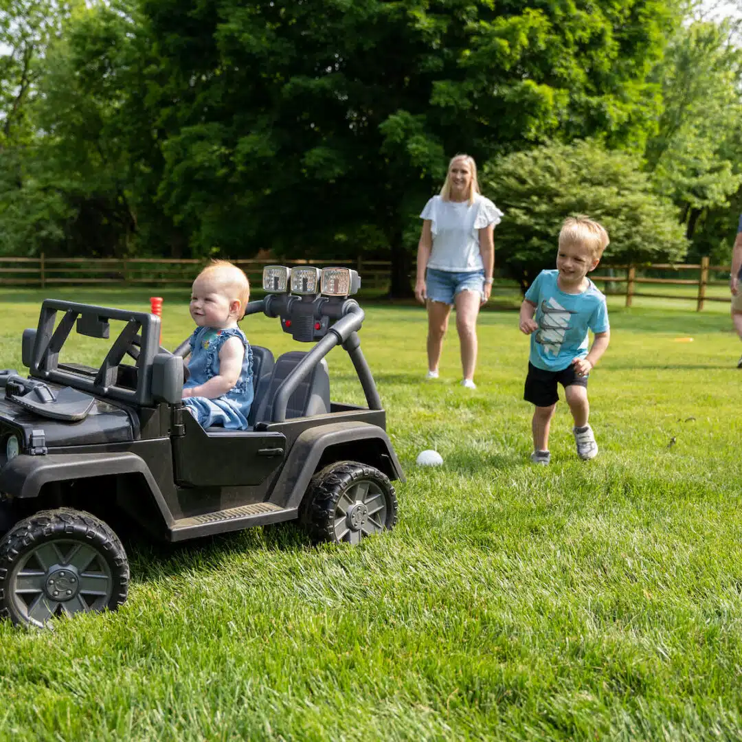 family playing in grass